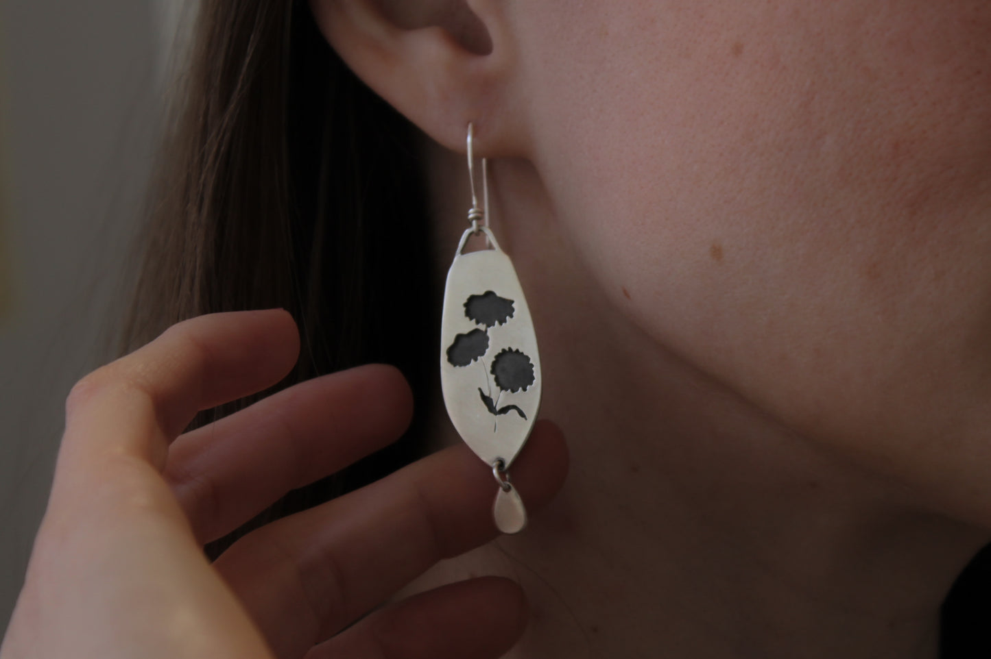 Coneflower dangle earrings, handmade floral earrings, recycled sterling silver earrings, nature-inspired jewelry, sustainable jewelry, eco-friendly earrings, botanical jewelry, artisan-made earrings, flower earrings, unique dangle earrings, handmade earrings, ethical jewelry, boho floral earrings, sustainable fashion, handmade in USA, eco-conscious jewelry, handcrafted earrings, statement floral earrings, heirloom quality earrings, wildflower earrings