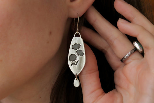 Coneflower dangle earrings, handmade floral earrings, recycled sterling silver earrings, nature-inspired jewelry, sustainable jewelry, eco-friendly earrings, botanical jewelry, artisan-made earrings, flower earrings, unique dangle earrings, handmade earrings, ethical jewelry, boho floral earrings, sustainable fashion, handmade in USA, eco-conscious jewelry, handcrafted earrings, statement floral earrings, heirloom quality earrings, wildflower earrings