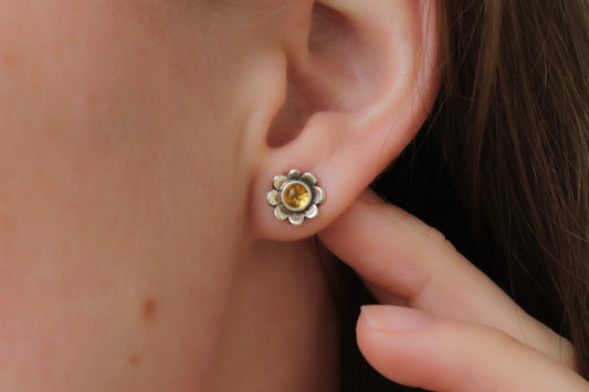 handmade daisy stud earrings, citrine earrings, sustainable floral jewelry, eco-friendly earrings, recycled sterling silver earrings, nature-inspired jewelry, floral earrings, sustainable jewelry, unique jewelry design, handcrafted earrings, daisy earrings, boho chic jewelry, mindful craftsmanship, artisanal earrings, sterling silver earrings, slow fashion, heirloom jewelry, ethically made jewelry, small batch jewelry, sustainable fashion accessories