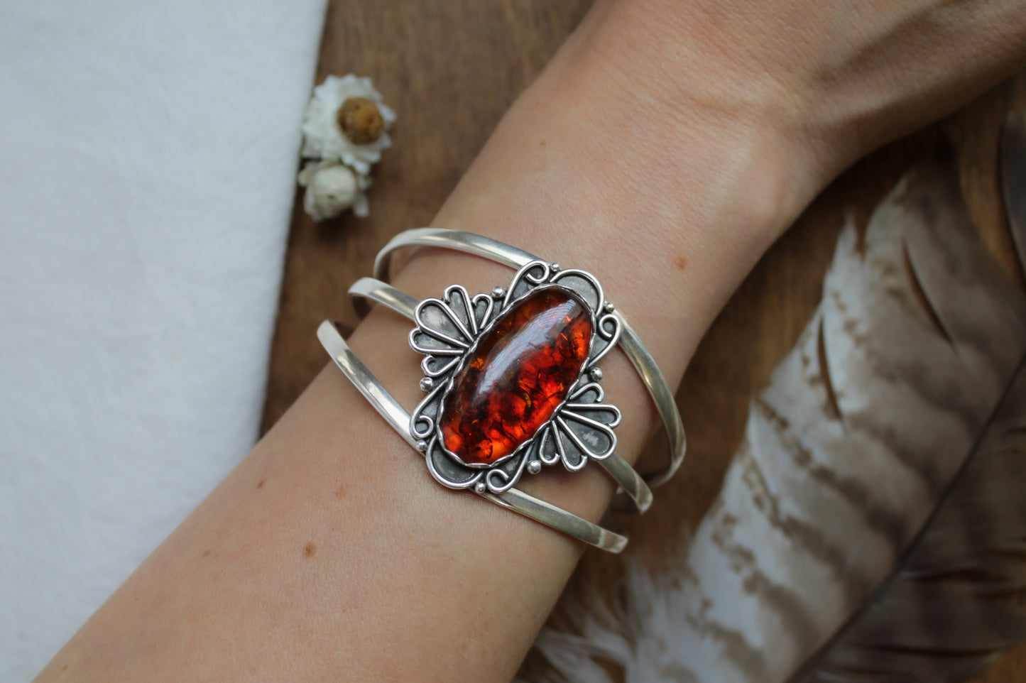 Baltic amber statement cuff bracelet with antique lace inspired sterling silver details, artisan handmade sustainable jewelry, adjustable ethical statement piece with warm honey baltic amber gemstone