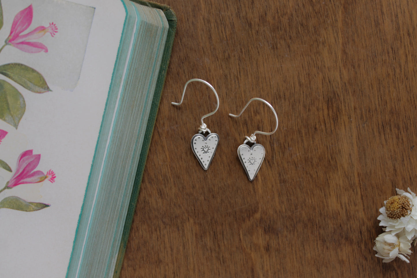 Sweet and romantic small sterling silver heart earrings with hand-stamped designs, ideal for meaningful Valentine’s Day jewelry.