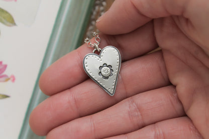 Heart pendant necklace crafted from recycled sterling silver, with whimsical hand-drawn details and a 16-inch oxidized chain