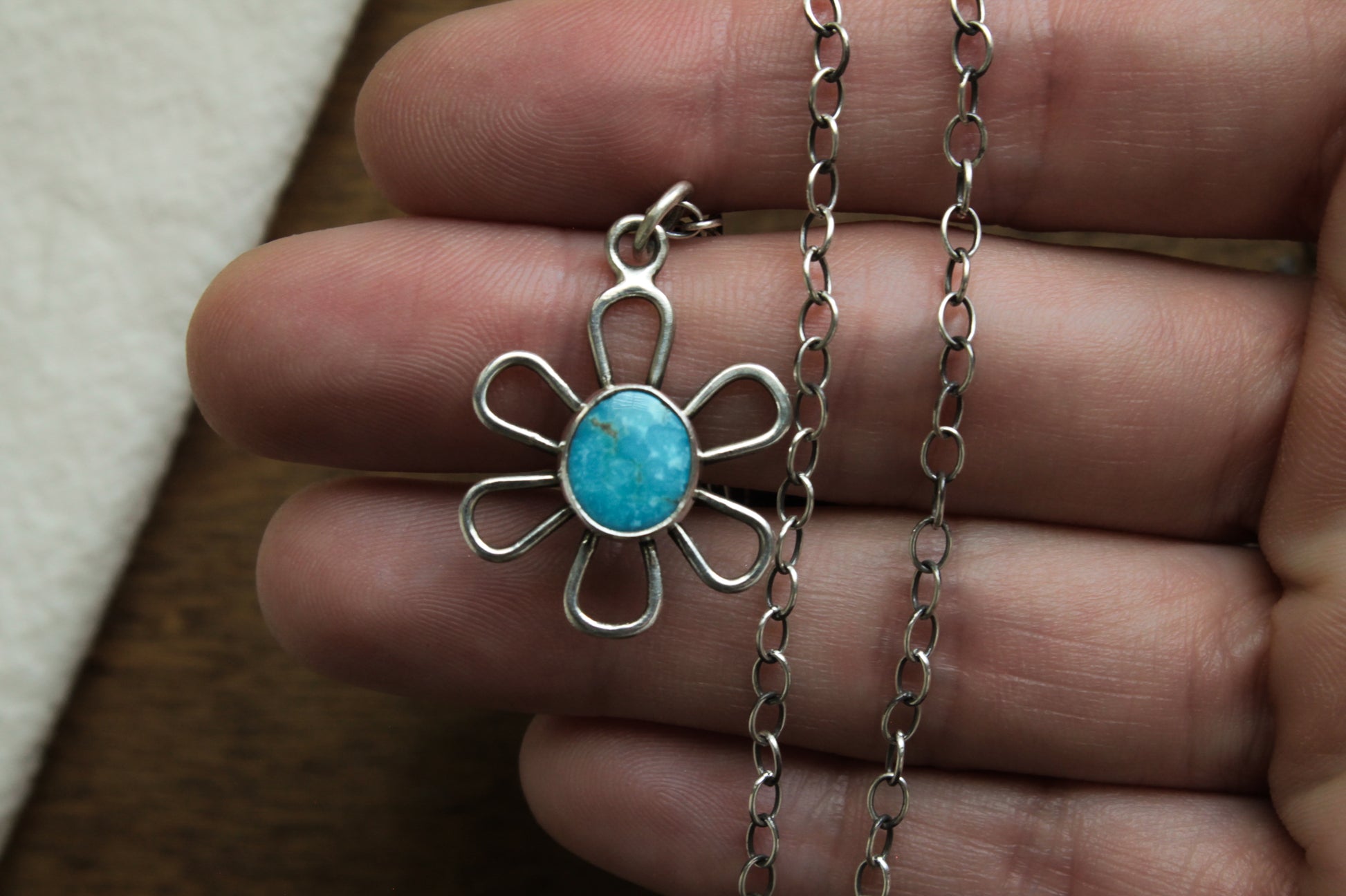 Unique Flower Power Necklace with a classic daisy motif, featuring genuine turquoise in a recycled silver setting, perfect for layering.