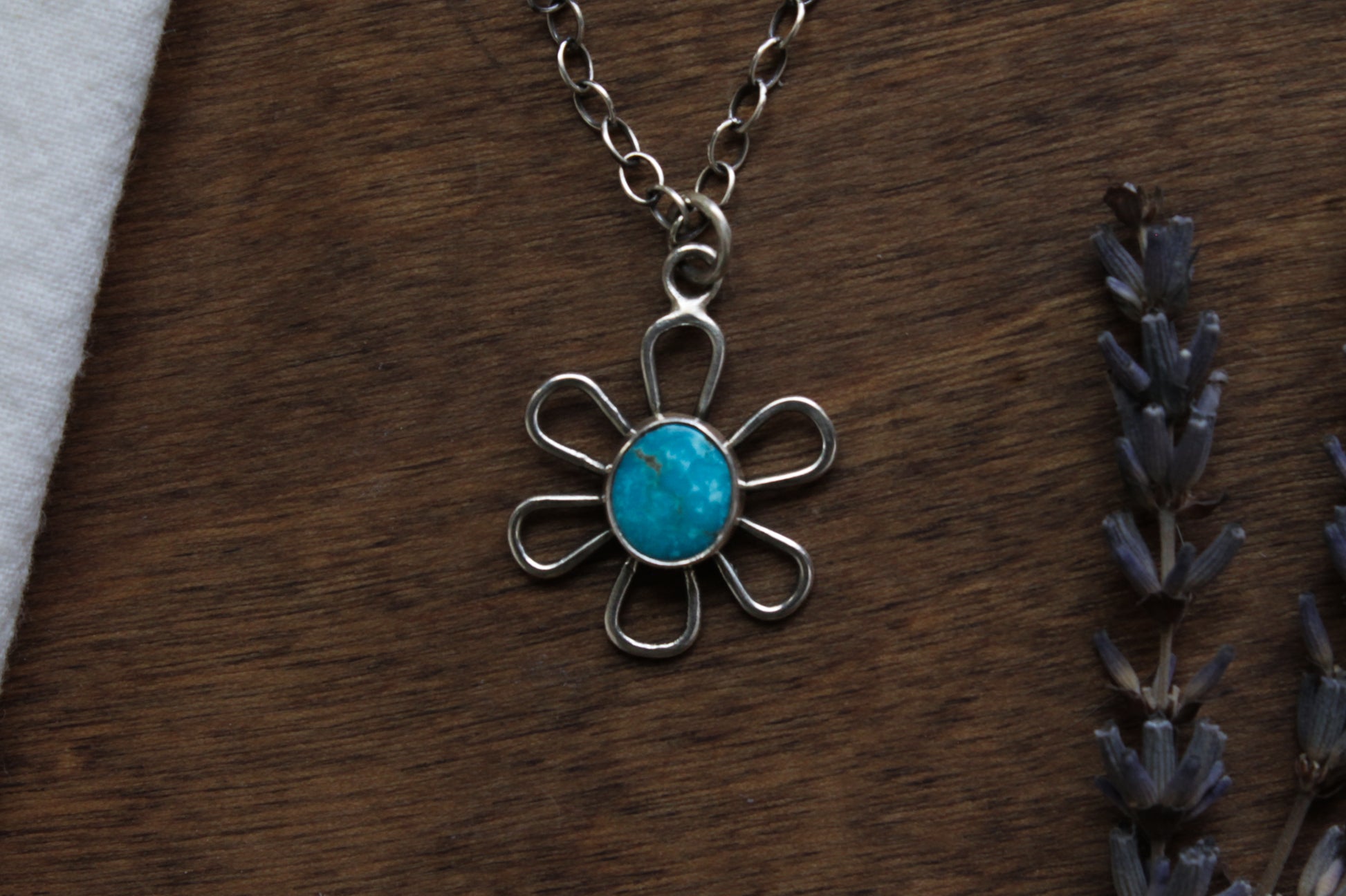 Handmade Flower Power Necklace with vibrant Kingman Turquoise, featuring a groovy vintage-inspired daisy design in responsibly sourced sterling silver.