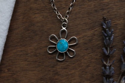 Handmade Flower Power Necklace with vibrant Kingman Turquoise, featuring a groovy vintage-inspired daisy design in responsibly sourced sterling silver.