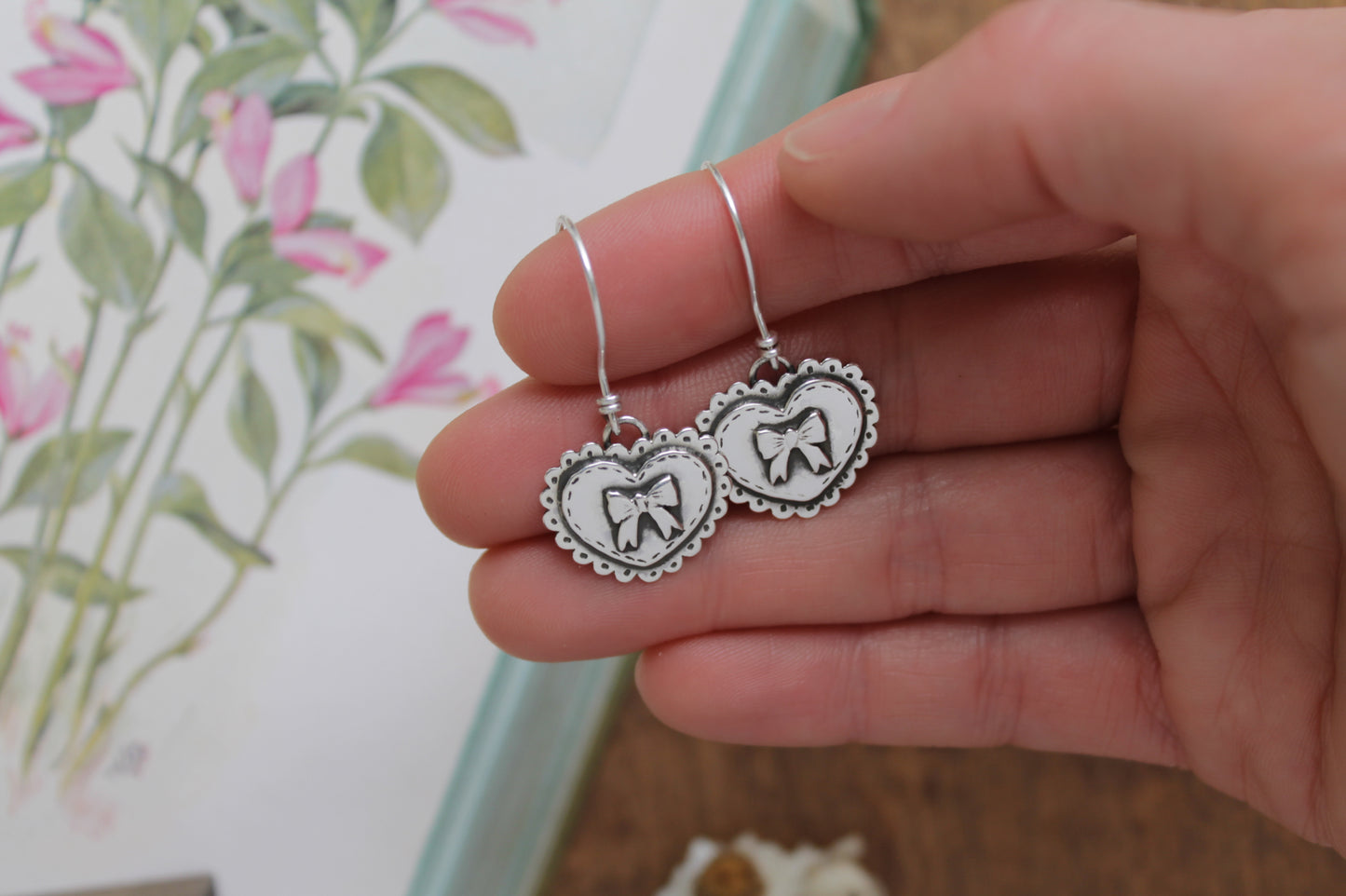 Love Bound Heart Earrings in sterling silver, inspired by romantic chocolate boxes and doilies, perfect for Valentine’s Day gifting.