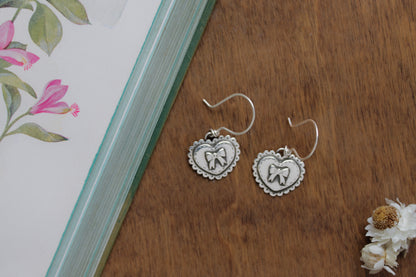 Love Bound Heart Earrings with intricate, hand-sawn designs and nostalgic details, perfect for sustainable jewelry lovers.