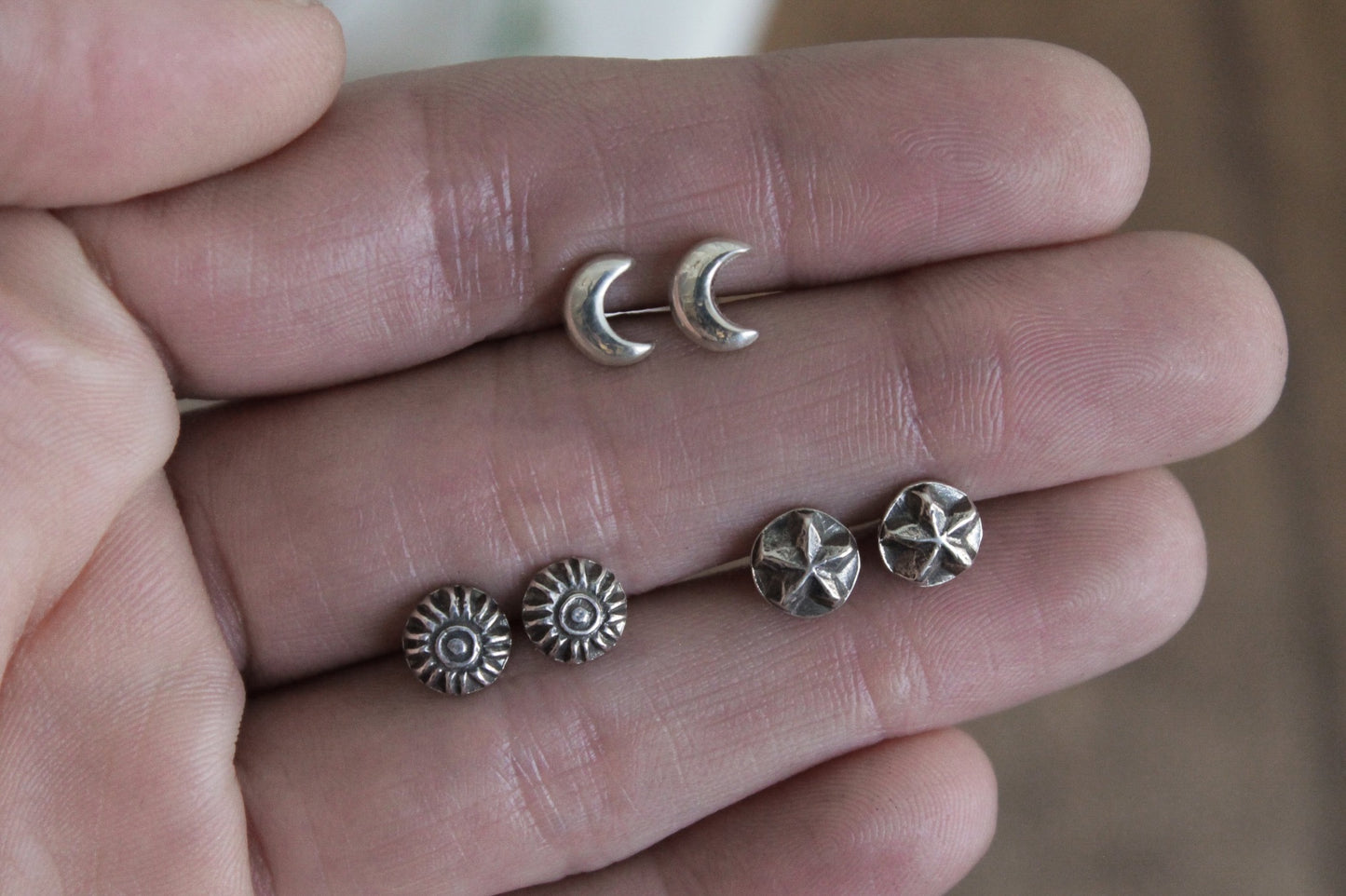 Celestial sterling silver stud earrings, handmade jewelry, celestial earrings, moon and star earrings, artisan earrings, sterling silver earrings, eco-friendly jewelry, nature-inspired jewelry, minimalistic jewelry, sustainable jewelry, celestial stud earrings, everyday earrings, handmade earrings, ethical jewelry, recycled silver earrings, celestial jewelry, silver studs, celestial-themed jewelry, artisan silver earrings, star and moon jewelry