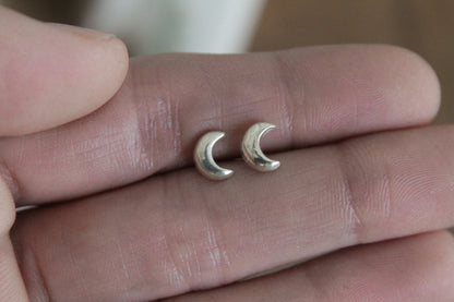 Celestial sterling silver stud earrings, handmade jewelry, celestial earrings, moon and star earrings, artisan earrings, sterling silver earrings, eco-friendly jewelry, nature-inspired jewelry, minimalistic jewelry, sustainable jewelry, celestial stud earrings, everyday earrings, handmade earrings, ethical jewelry, recycled silver earrings, celestial jewelry, silver studs, celestial-themed jewelry, artisan silver earrings, star and moon jewelry
