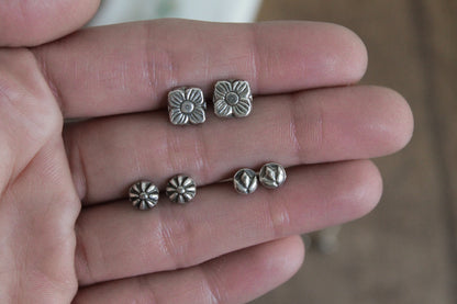 floral sterling silver stud earrings, sterling silver stud earrings, floral earrings, sustainable jewelry, handmade earrings, eco-friendly earrings, nature-inspired earrings, recycled silver jewelry, floral silver studs, artisan jewelry, ethical jewelry, minimalist earrings, everyday earrings, unique jewelry design, heirloom-quality earrings, handcrafted earrings, eco-conscious jewelry, floral stud earrings for women, silver flower earrings, dainty silver earrings