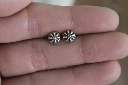 floral sterling silver stud earrings, sterling silver stud earrings, floral earrings, sustainable jewelry, handmade earrings, eco-friendly earrings, nature-inspired earrings, recycled silver jewelry, floral silver studs, artisan jewelry, ethical jewelry, minimalist earrings, everyday earrings, unique jewelry design, heirloom-quality earrings, handcrafted earrings, eco-conscious jewelry, floral stud earrings for women, silver flower earrings, dainty silver earrings