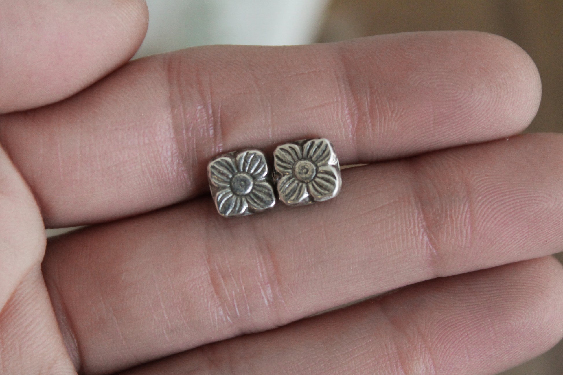 floral sterling silver stud earrings, sterling silver stud earrings, floral earrings, sustainable jewelry, handmade earrings, eco-friendly earrings, nature-inspired earrings, recycled silver jewelry, floral silver studs, artisan jewelry, ethical jewelry, minimalist earrings, everyday earrings, unique jewelry design, heirloom-quality earrings, handcrafted earrings, eco-conscious jewelry, floral stud earrings for women, silver flower earrings, dainty silver earrings