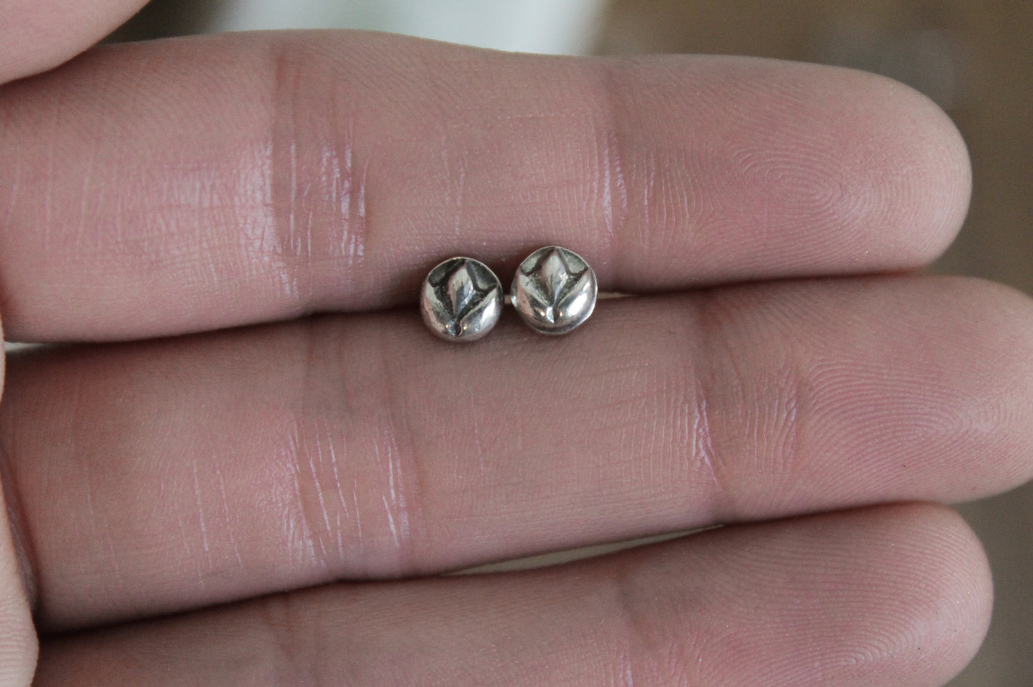 floral sterling silver stud earrings, sterling silver stud earrings, floral earrings, sustainable jewelry, handmade earrings, eco-friendly earrings, nature-inspired earrings, recycled silver jewelry, floral silver studs, artisan jewelry, ethical jewelry, minimalist earrings, everyday earrings, unique jewelry design, heirloom-quality earrings, handcrafted earrings, eco-conscious jewelry, floral stud earrings for women, silver flower earrings, dainty silver earrings