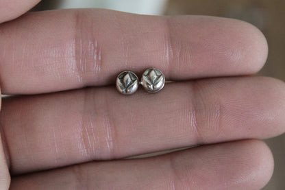 floral sterling silver stud earrings, sterling silver stud earrings, floral earrings, sustainable jewelry, handmade earrings, eco-friendly earrings, nature-inspired earrings, recycled silver jewelry, floral silver studs, artisan jewelry, ethical jewelry, minimalist earrings, everyday earrings, unique jewelry design, heirloom-quality earrings, handcrafted earrings, eco-conscious jewelry, floral stud earrings for women, silver flower earrings, dainty silver earrings